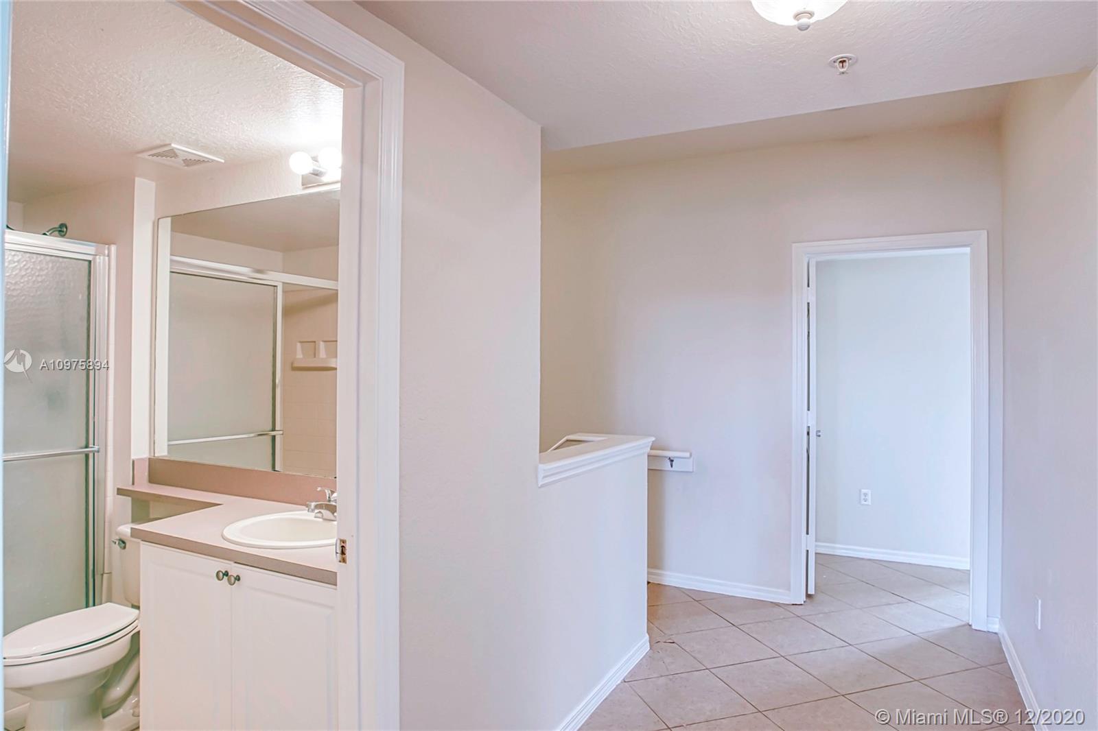 6400 West Sample Road, Unit 6400 Coral Springs, FL 33067 - Photo 15 of 23 Bathroom and hallway.