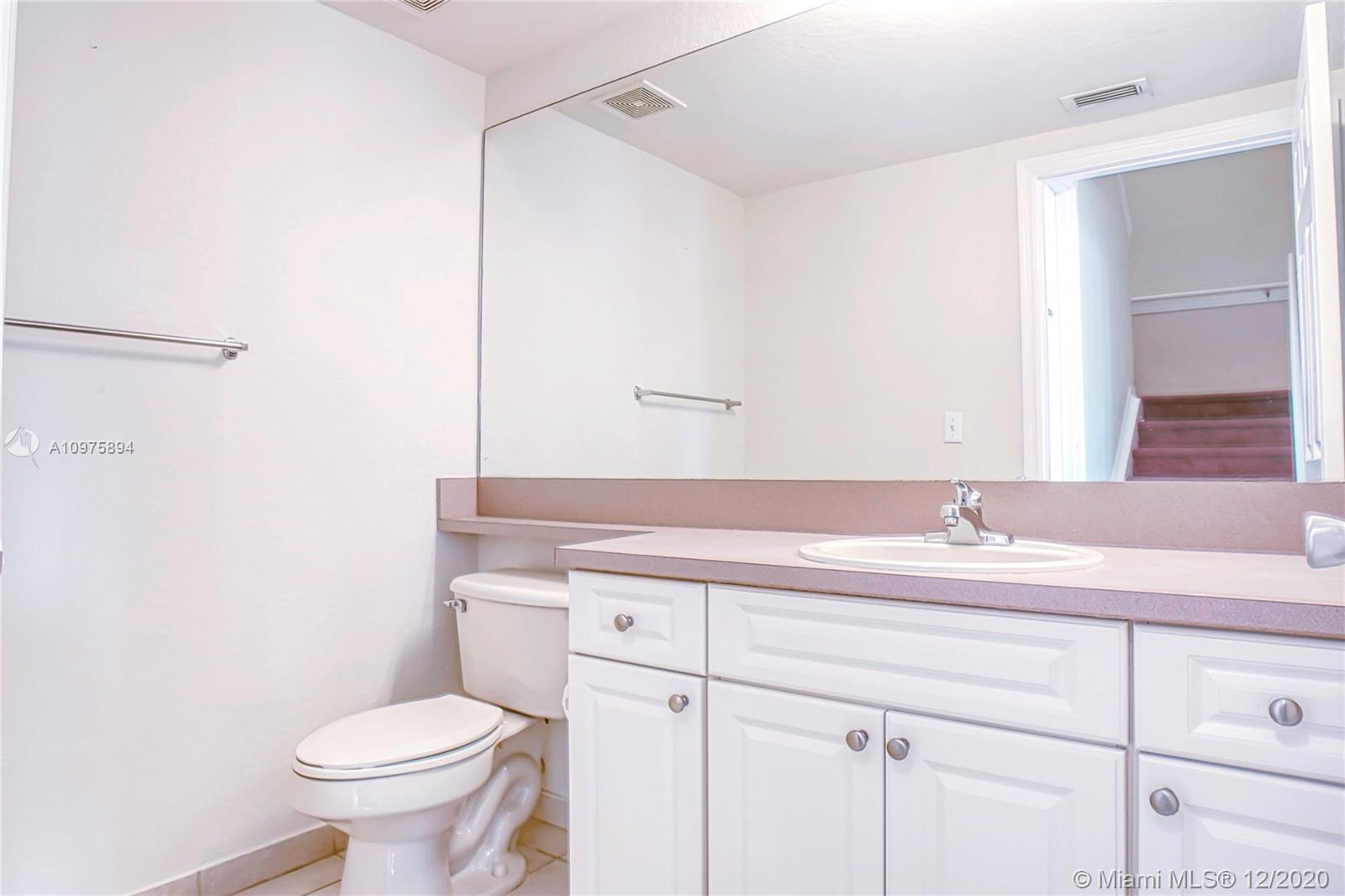 6400 West Sample Road, Unit 6400 Coral Springs, FL 33067 - Photo 9 of 23 Half bathroom by the living room.