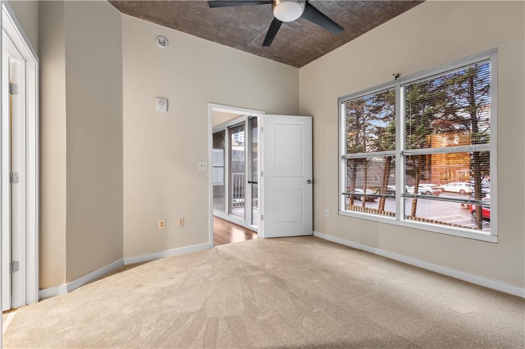 250 Pharr Road Northeast, Unit 308 Atlanta, GA 30305 - Photo 11 of 35 a view of an empty room with a window