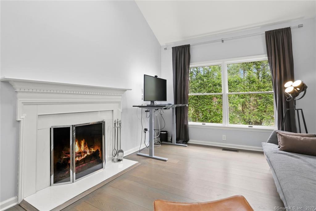 13 Old Stamford Road, Unit 13 New Canaan, CT 06840 - Photo 14 of 39 a living room with furniture and a fireplace