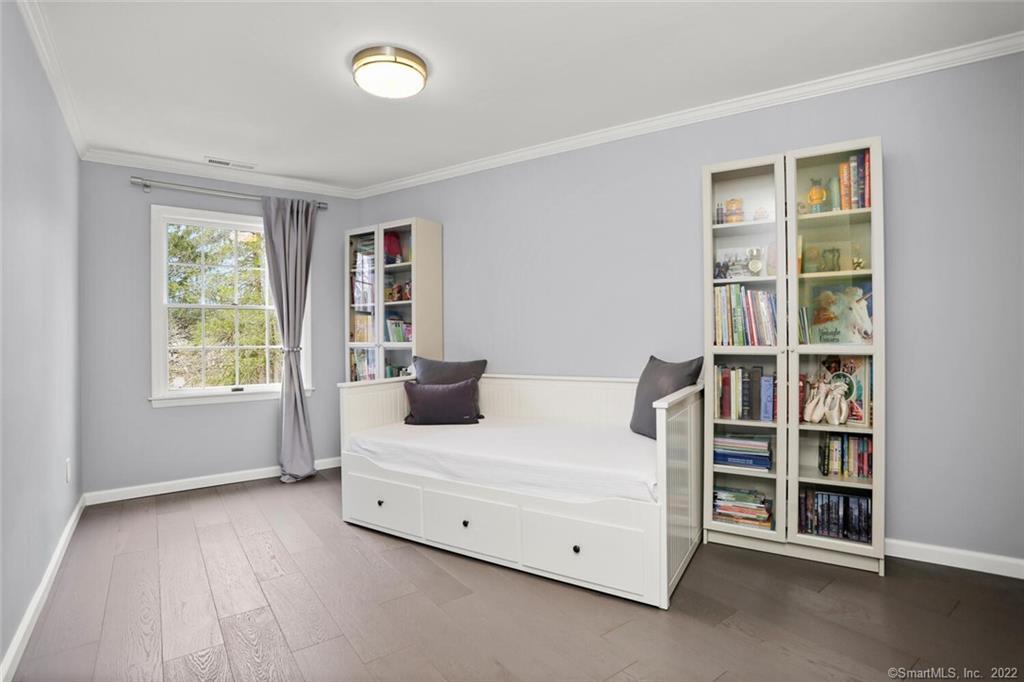 13 Old Stamford Road, Unit 13 New Canaan, CT 06840 - Photo 17 of 39 a bed room with a bed and a window