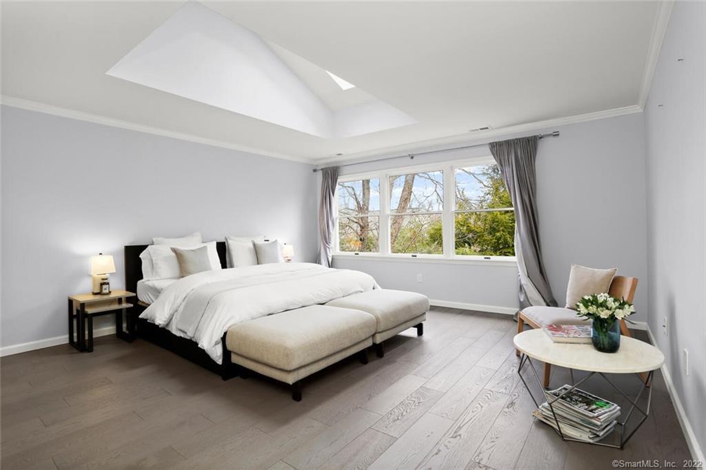 13 Old Stamford Road, Unit 13 New Canaan, CT 06840 - Photo 19 of 39 a bedroom with a bed and a couch