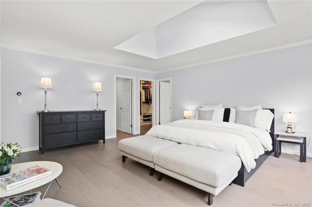 13 Old Stamford Road, Unit 13 New Canaan, CT 06840 - Photo 21 of 39 a bedroom with a bed and a couch