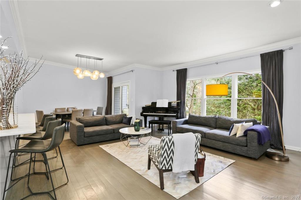 13 Old Stamford Road, Unit 13 New Canaan, CT 06840 - Photo 3 of 39 a living room with furniture and a large window