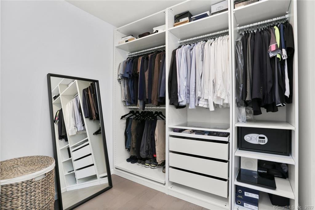 13 Old Stamford Road, Unit 13 New Canaan, CT 06840 - Photo 32 of 39 a view of walk in closet with clothes and shoes