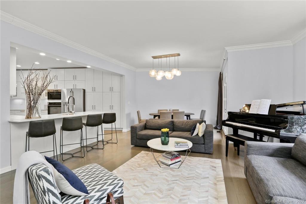 13 Old Stamford Road, Unit 13 New Canaan, CT 06840 - Photo 5 of 39 a living room with furniture and a wooden floor
