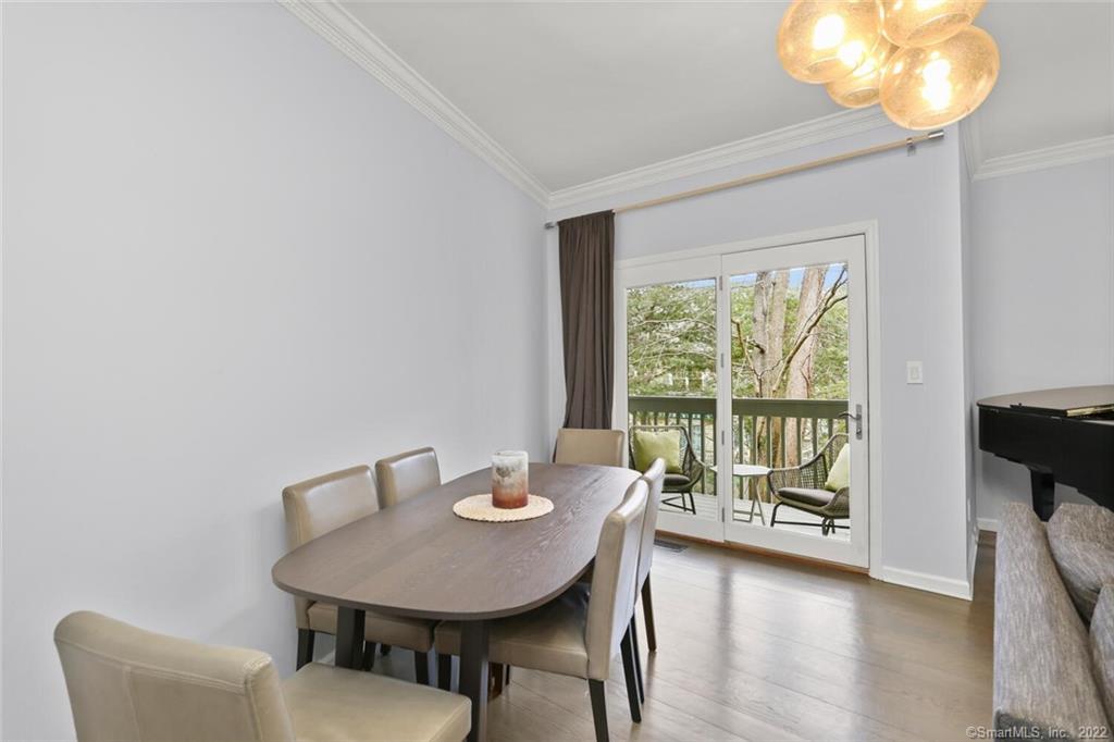 13 Old Stamford Road, Unit 13 New Canaan, CT 06840 - Photo 6 of 39 a view of a room with a table and chairs