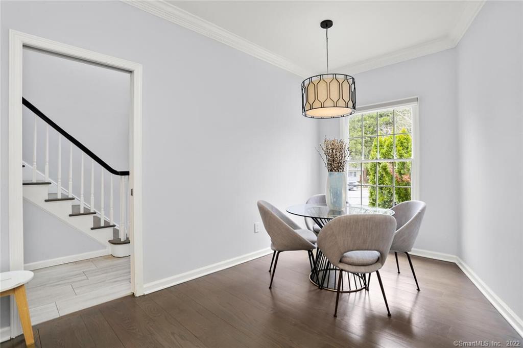 13 Old Stamford Road, Unit 13 New Canaan, CT 06840 - Photo 10 of 39 a view of a dining room with furniture window and wooden floor