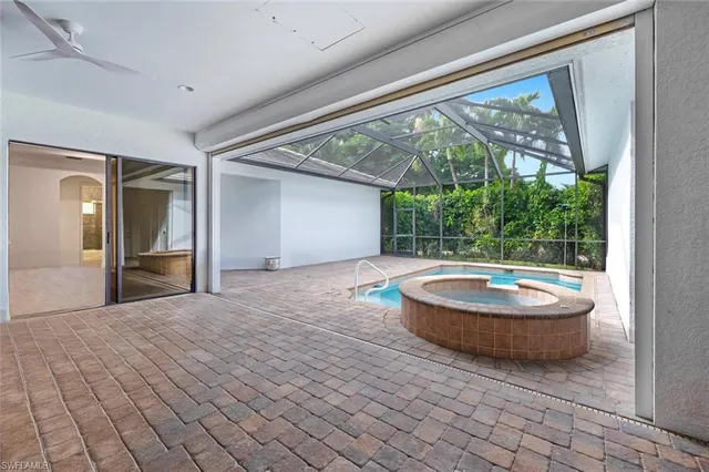 a living room with a large window and a table