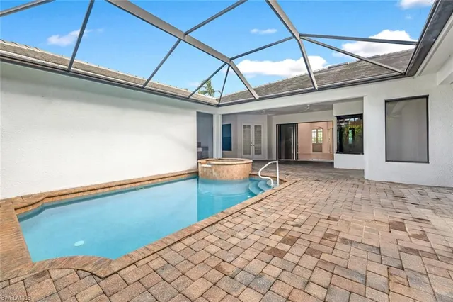 a view of an empty room with glass door