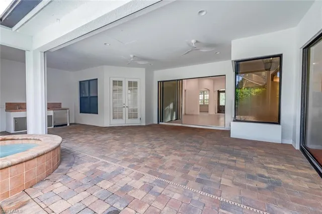 a view of a backyard with table and chairs