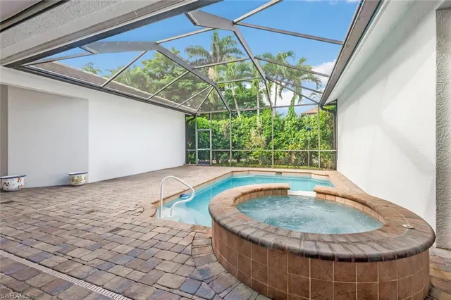a view of kitchen with cabinets