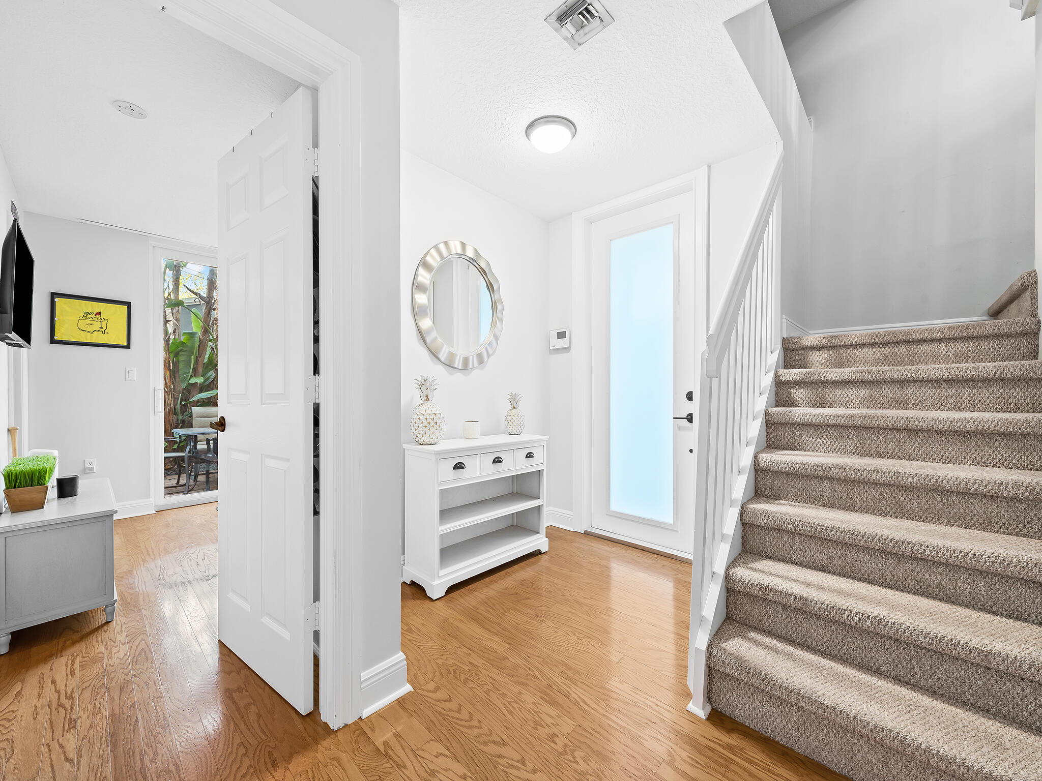 705 Southwest 4th Avenue Fort Lauderdale, FL 33315 - Photo 13 of 25 a view of an entryway with wooden floor and windows