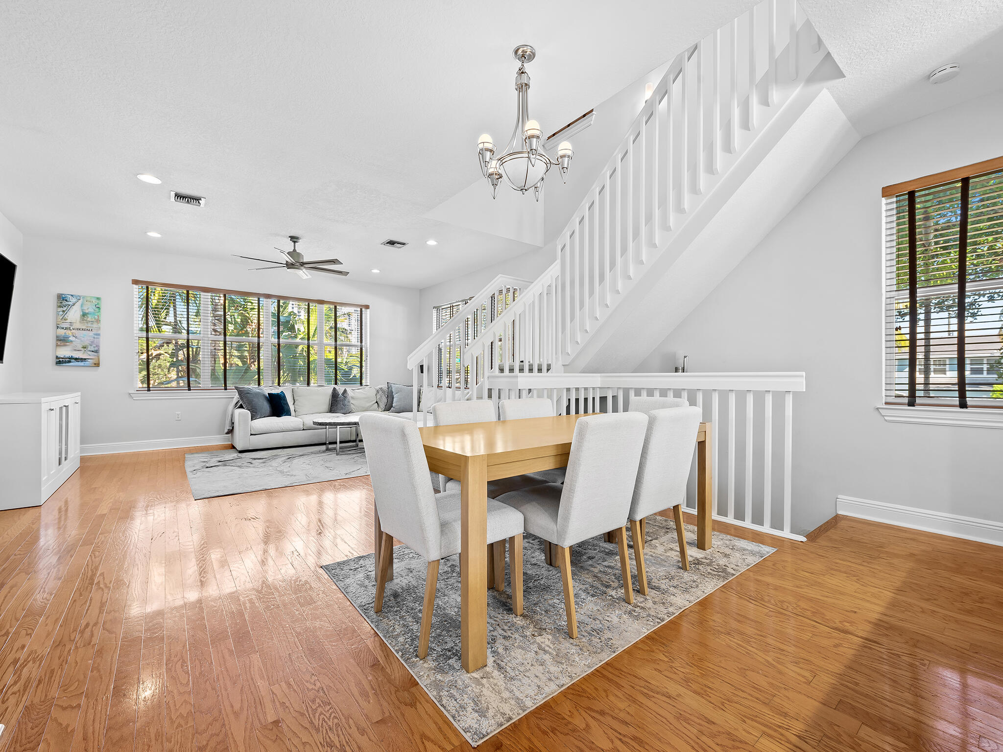 705 Southwest 4th Avenue Fort Lauderdale, FL 33315 - Photo 8 of 25 a dining room with wooden floor and a floor to ceiling window