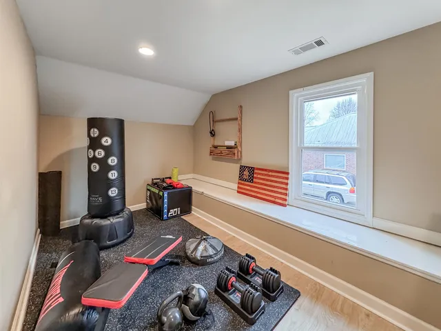 a room with furniture and a wooden floor