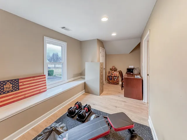 a view of a workspace with furniture