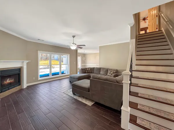 a view of a house with backyard and sitting area