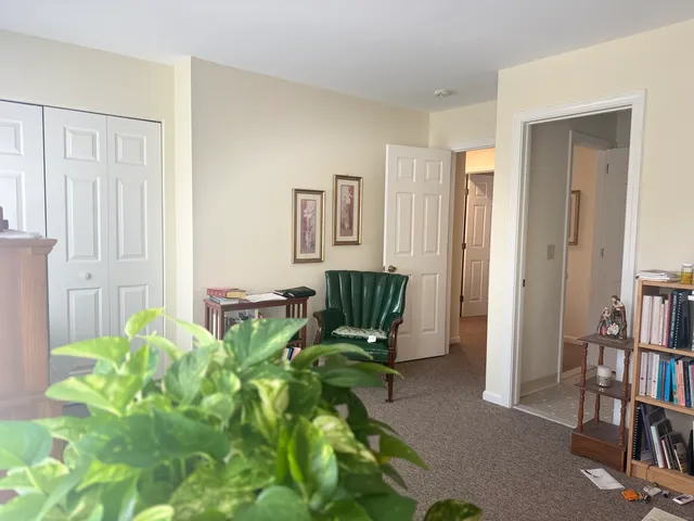 a bedroom with bed and a couch