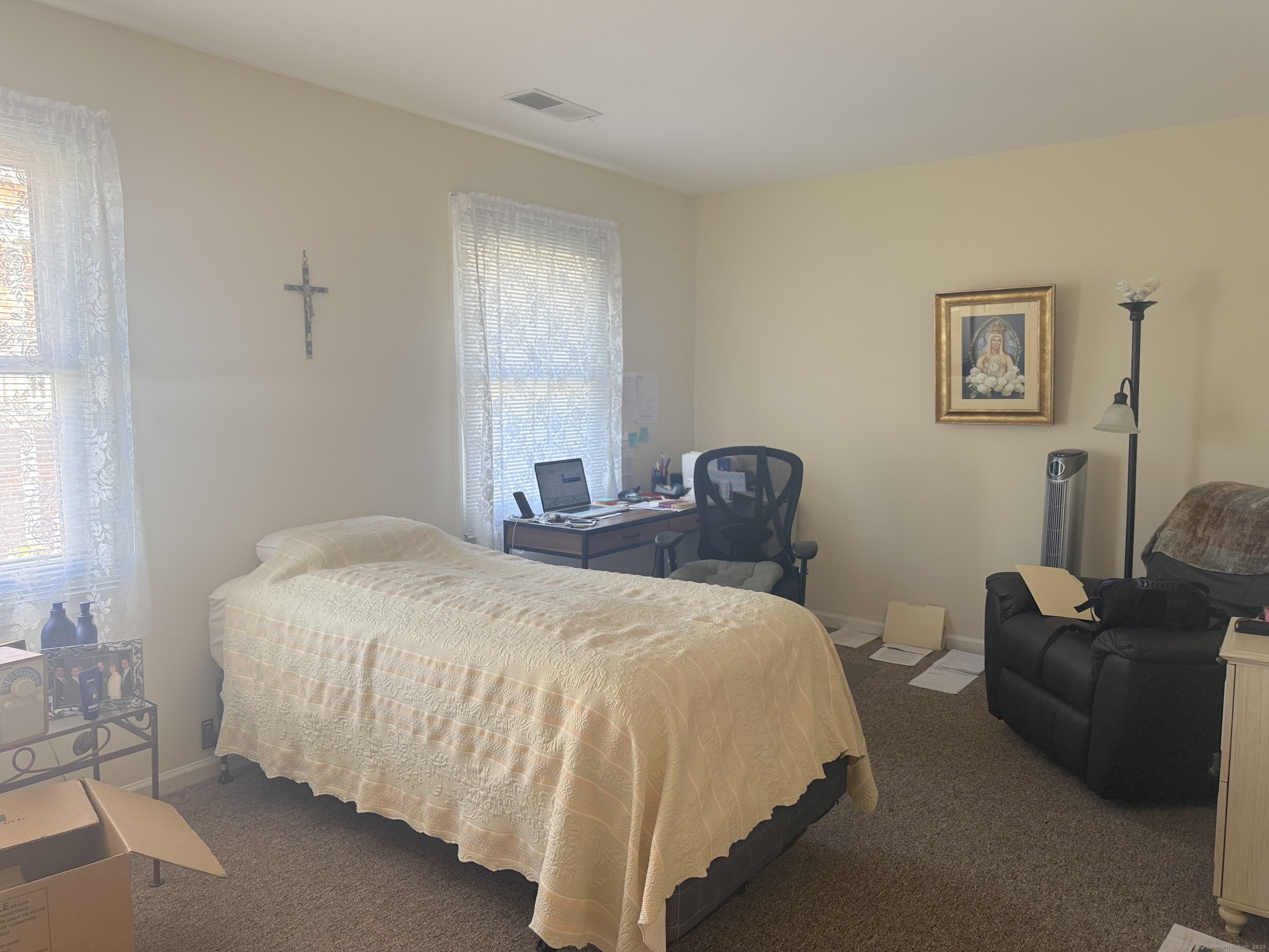 87 Gerrish Avenue, Unit T2 East Haven, CT 06512 - Photo 10 of 12 a bedroom with bed and a couch