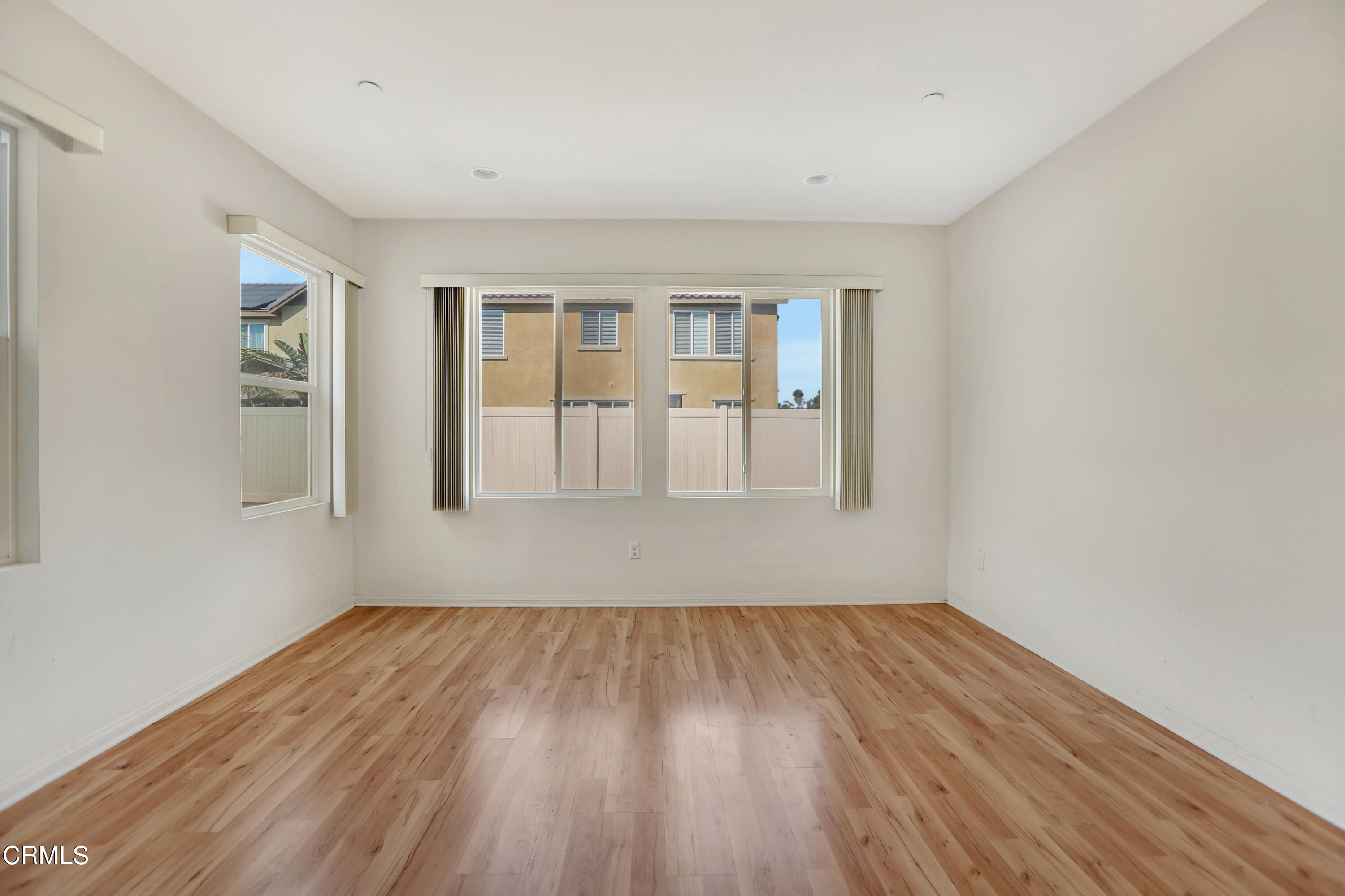 511 Whalen Way Oxnard, CA 93036 - Photo 7 of 28 a view of empty room with wooden floor and fan