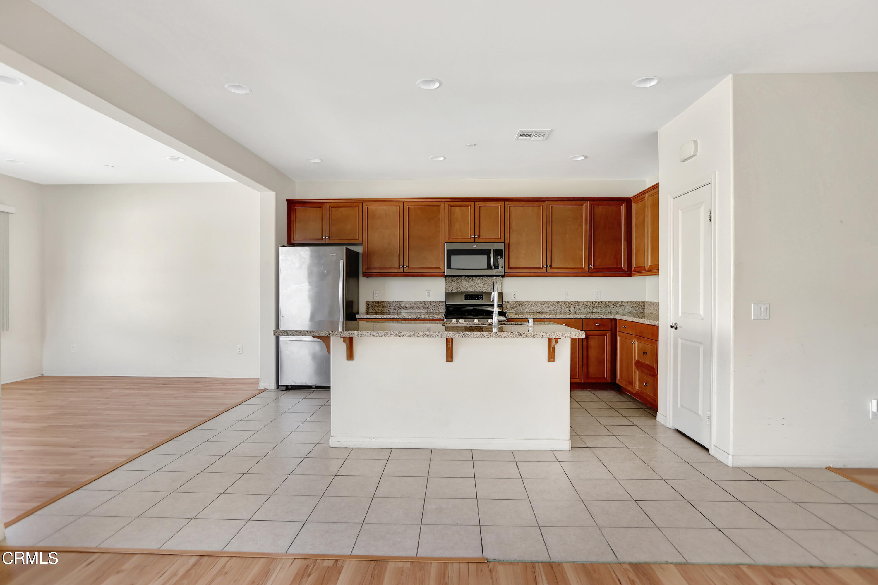 511 Whalen Way Oxnard, CA 93036 - Photo 8 of 28 a view of kitchen with stainless steel appliances a refrigerator sink and microwave