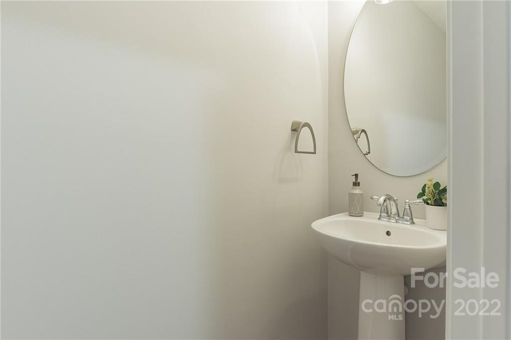 433 Hunters Dance Road Fort Mill, SC 29708 - Photo 11 of 25 a bathroom with a sink and mirror