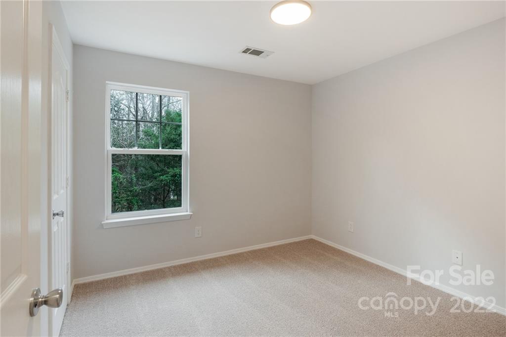 433 Hunters Dance Road Fort Mill, SC 29708 - Photo 14 of 25 an empty room with a window
