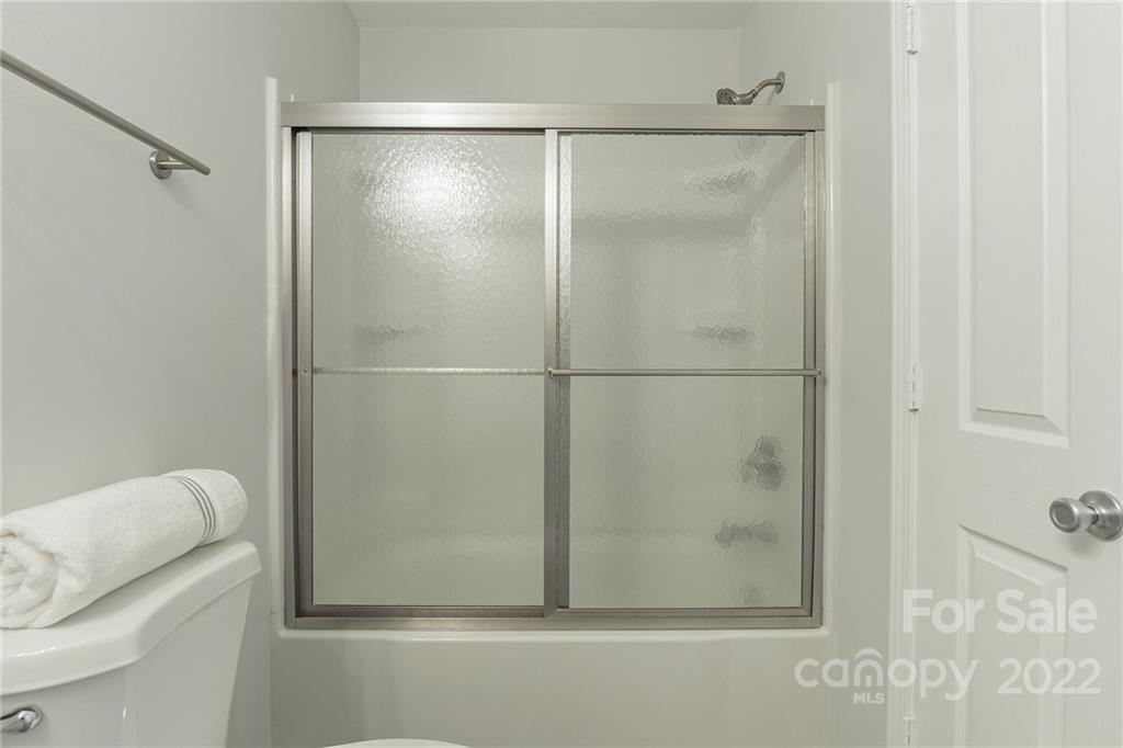 433 Hunters Dance Road Fort Mill, SC 29708 - Photo 17 of 25 a bathroom with a glass shower door