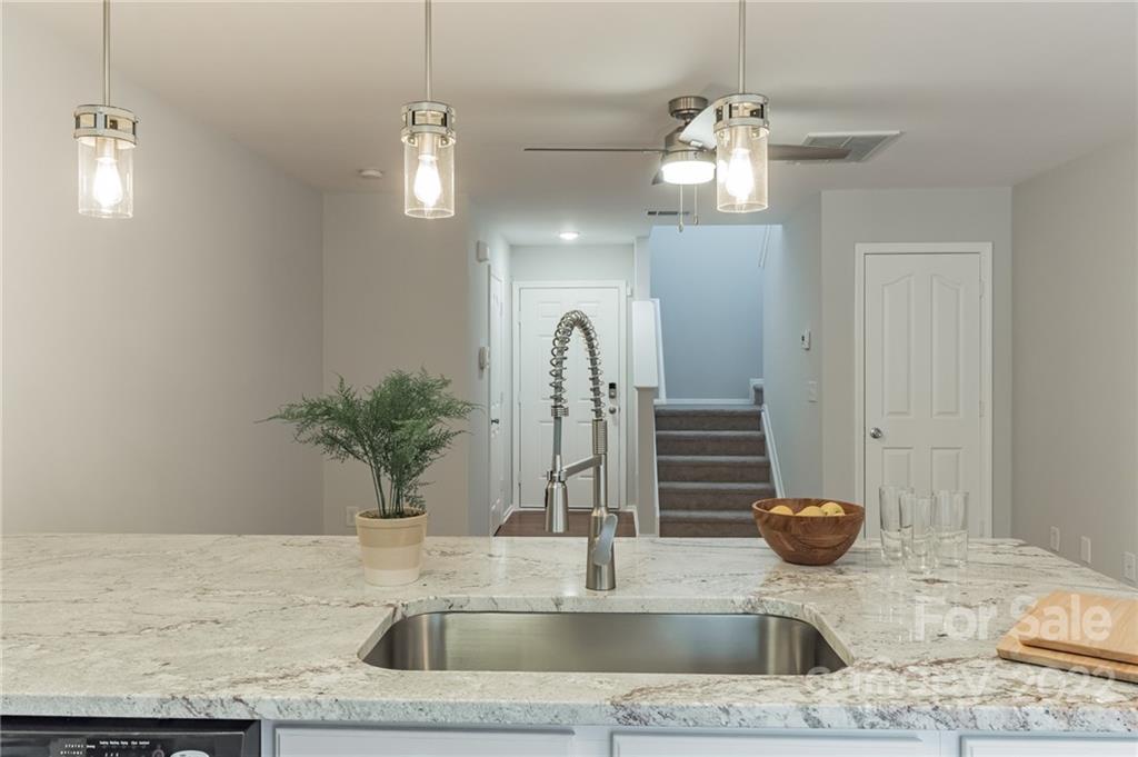 433 Hunters Dance Road Fort Mill, SC 29708 - Photo 9 of 25 a bathroom with a granite countertop sink a potted plant and a mirror