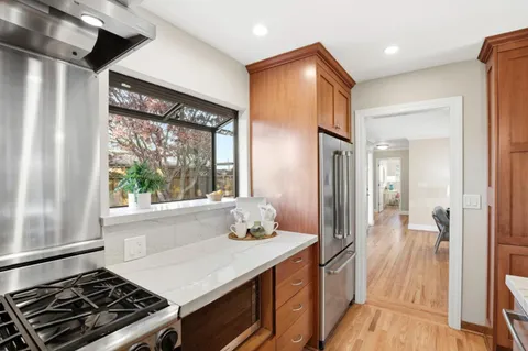 a kitchen with a stove and a shower
