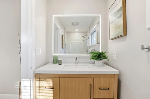 a bathroom with a sink and a mirror
