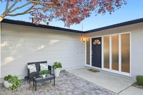 a view of porch with a bench