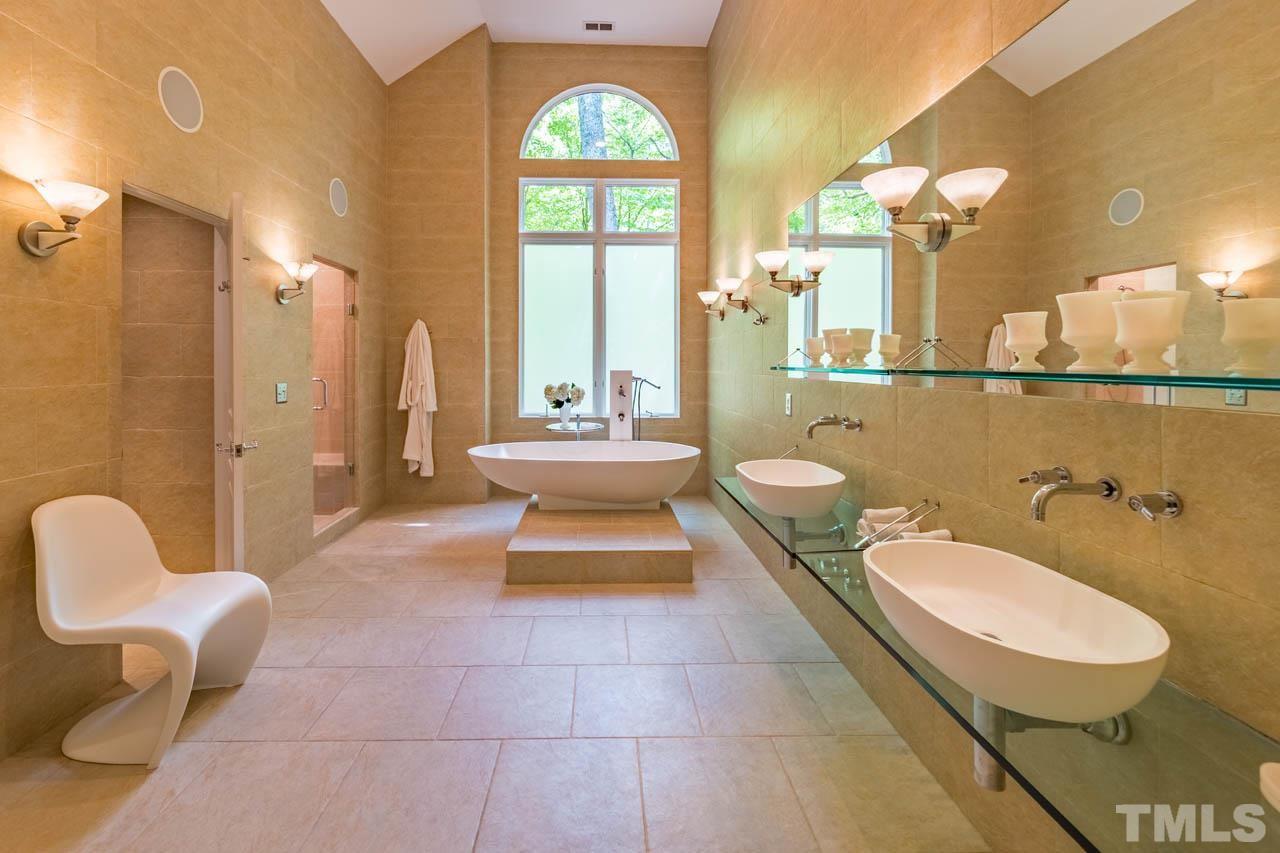 5415 Taproot Lane Durham, NC 27705 - Photo 18 of 30 a bathroom with a toilet sink and mirror