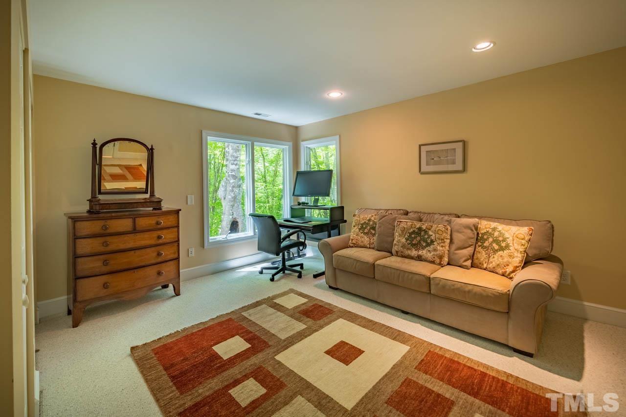 5415 Taproot Lane Durham, NC 27705 - Photo 25 of 30 a living room with furniture and a rug