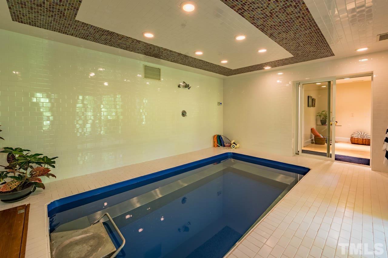 5415 Taproot Lane Durham, NC 27705 - Photo 27 of 30 a bathroom with a sink and a large mirror