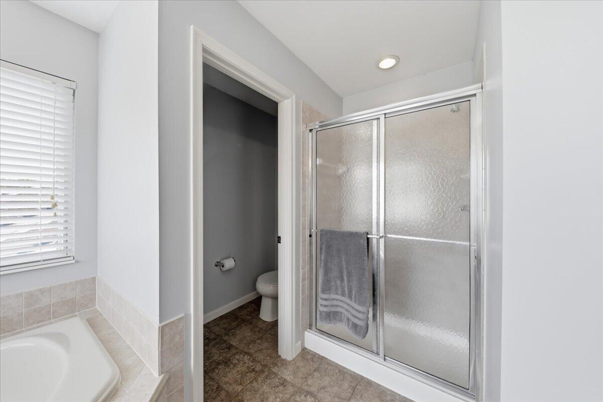 796 Rudolph Way Erlanger, KY 41018 - Photo 36 of 49 796 Rudolph Way, Erlanger KY 41018-Recessed lighting, enclosed shower with glass doors, built-in bathtub with tiled surround.