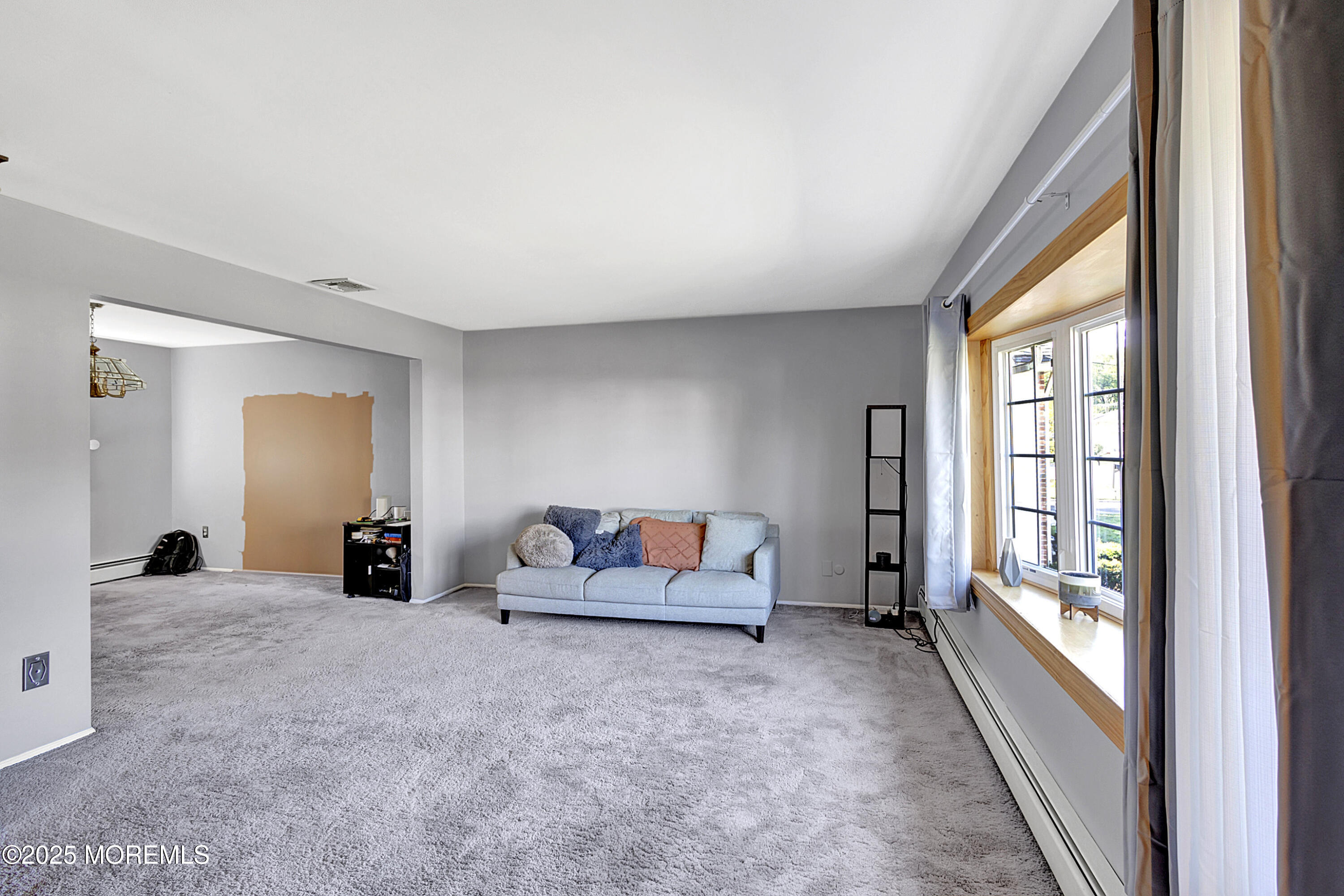 32 Kilfoyle Avenue Fords, NJ 08863 - Photo 2 of 33 a living room with furniture and a large window