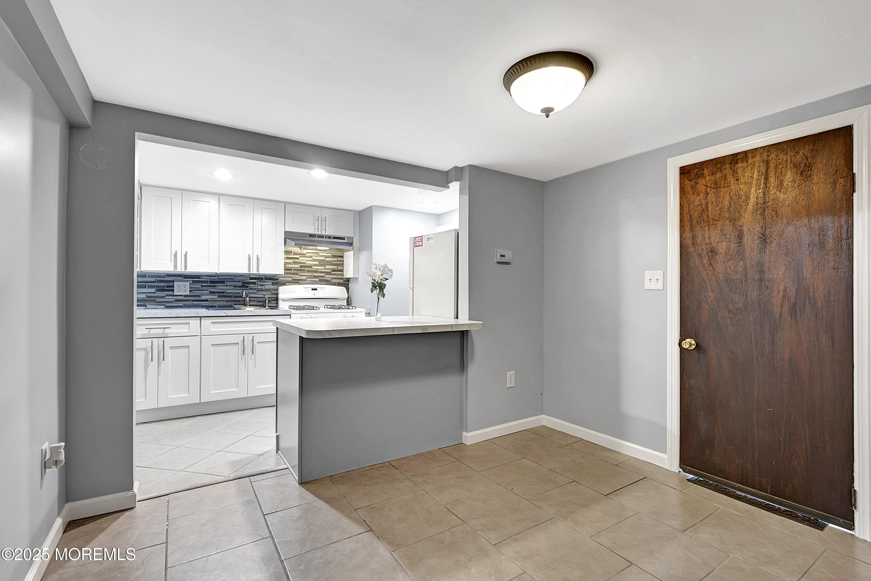 32 Kilfoyle Avenue Fords, NJ 08863 - Photo 24 of 33 a kitchen with a refrigerator and white cabinets