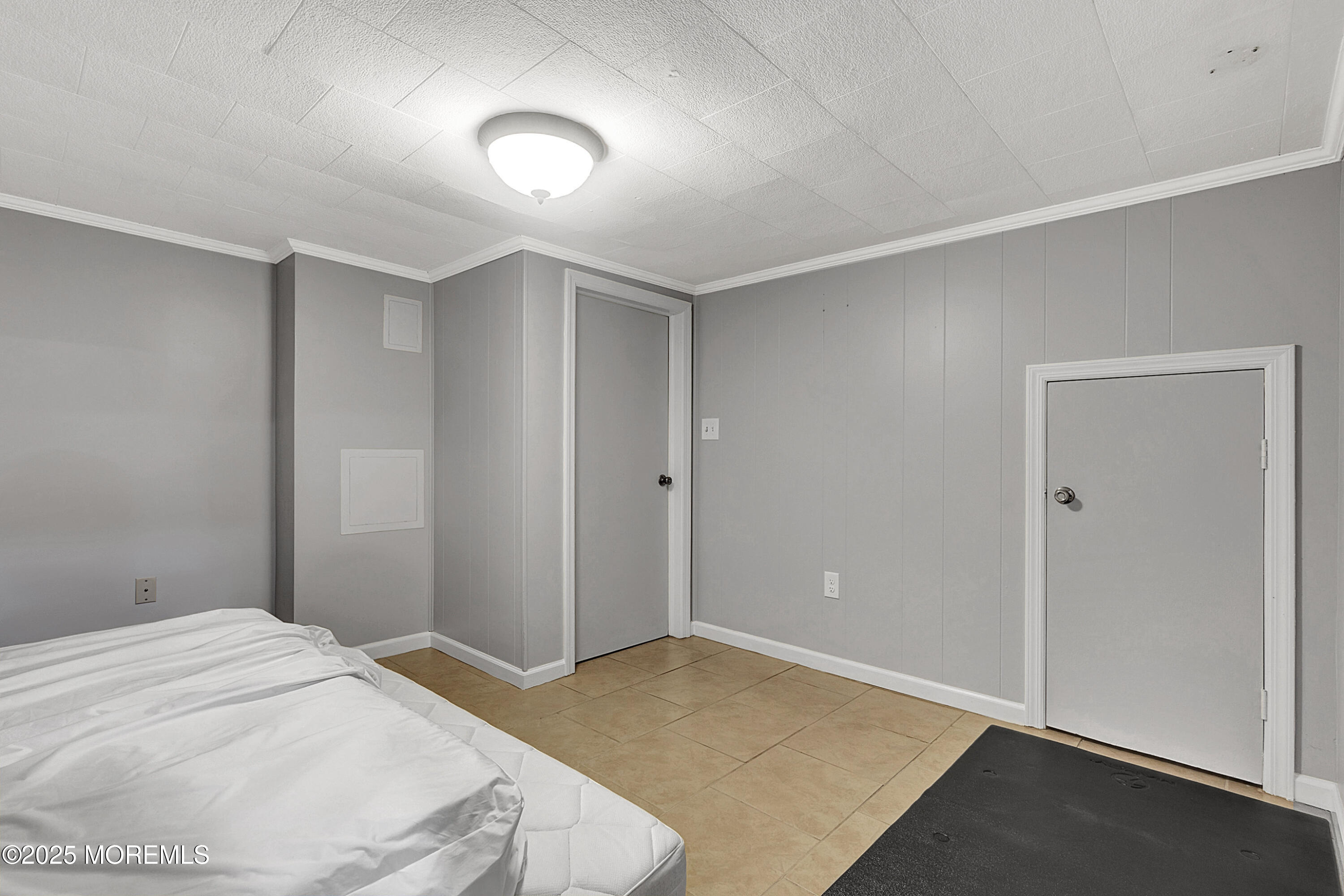 32 Kilfoyle Avenue Fords, NJ 08863 - Photo 26 of 33 a bedroom with a bed and a lamp on dresser