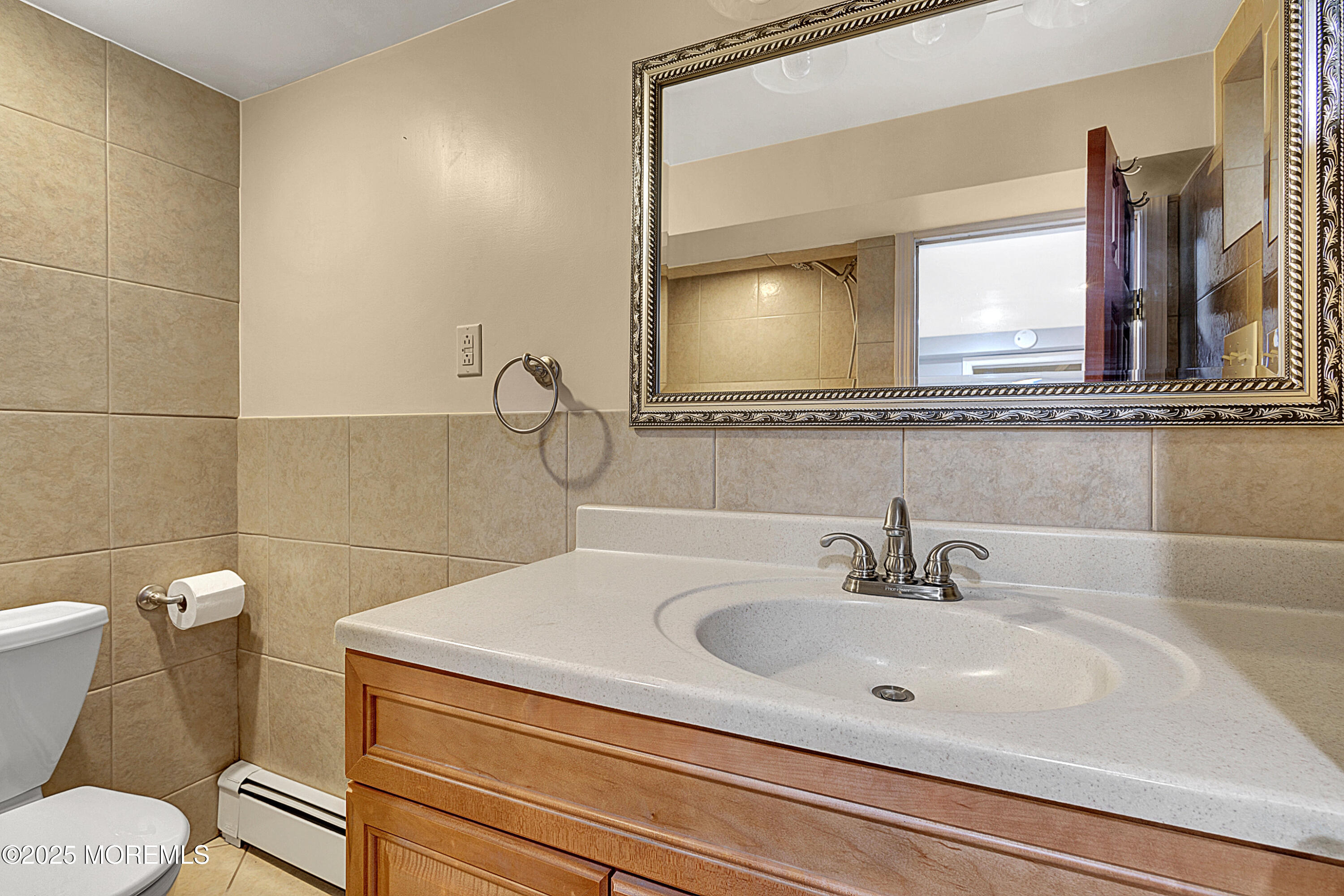 32 Kilfoyle Avenue Fords, NJ 08863 - Photo 28 of 33 a bathroom with a sink and a mirror