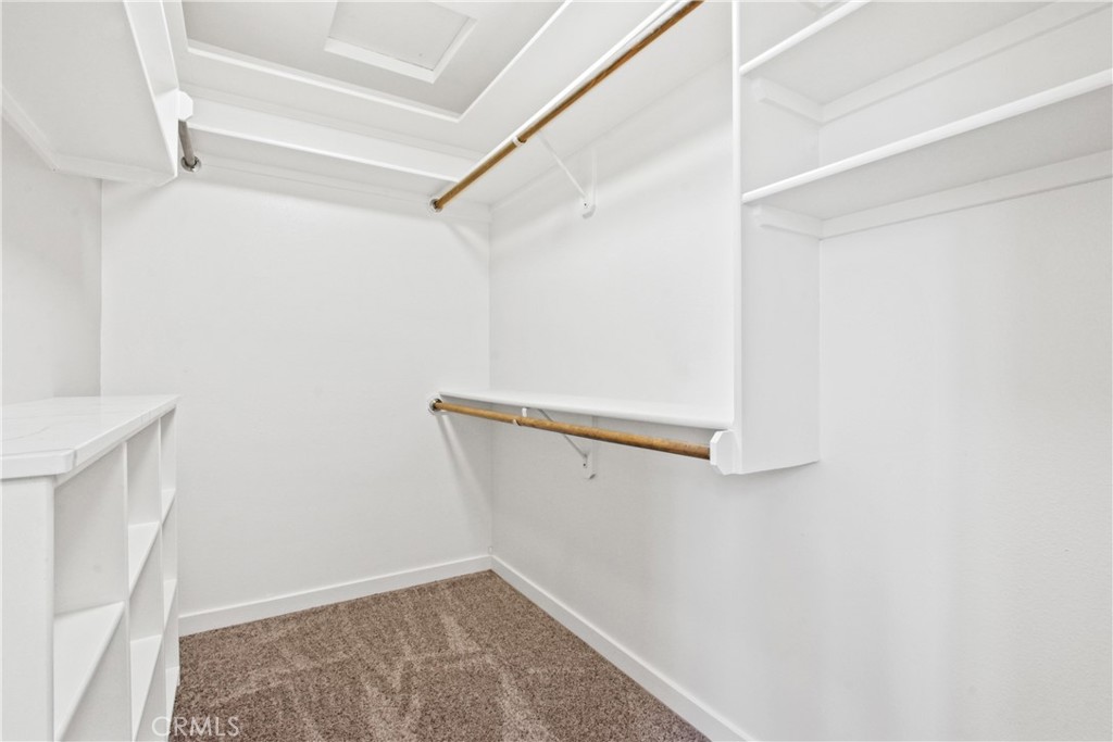 8410 Arrow Route Rancho Cucamonga, CA 91730 - Photo 13 of 24 a view of walk in closet with empty racks
