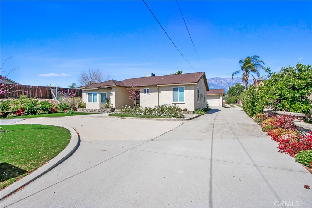 8410 Arrow Route Rancho Cucamonga, CA 91730 - Photo 2 of 24 a front view of a house with a yard