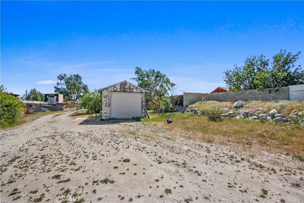8410 Arrow Route Rancho Cucamonga, CA 91730 - Photo 23 of 24 a view of a dry yard with trees