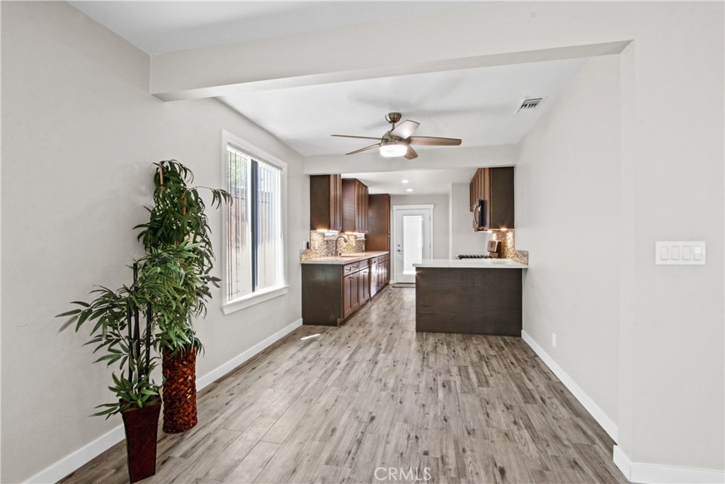8410 Arrow Route Rancho Cucamonga, CA 91730 - Photo 7 of 24 a view of kitchen with sink and refrigerator