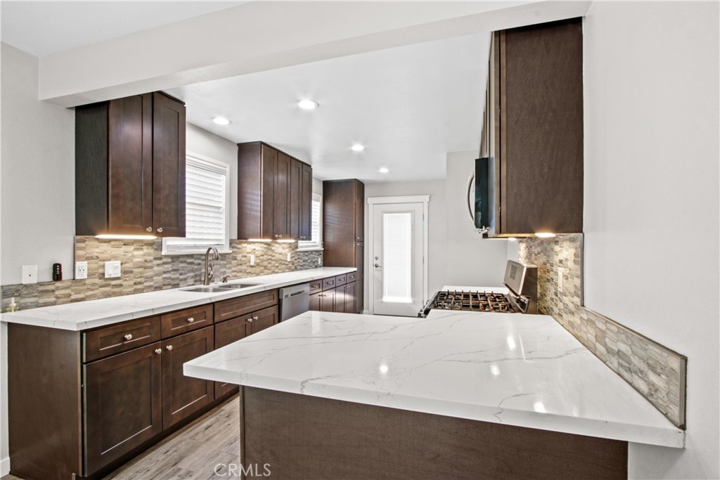 8410 Arrow Route Rancho Cucamonga, CA 91730 - Photo 9 of 24 a bathroom with a sink and a mirror