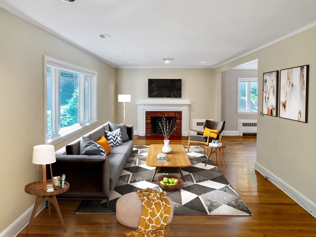a living room with furniture fireplace and a flat screen tv