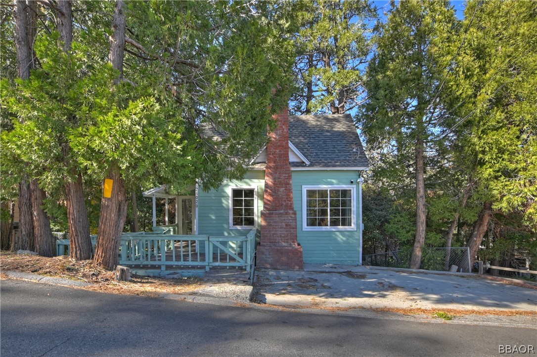 24020 Bowl Road Crestline, CA 92325 - Photo 1 of 35 a view of the house with a tree in front