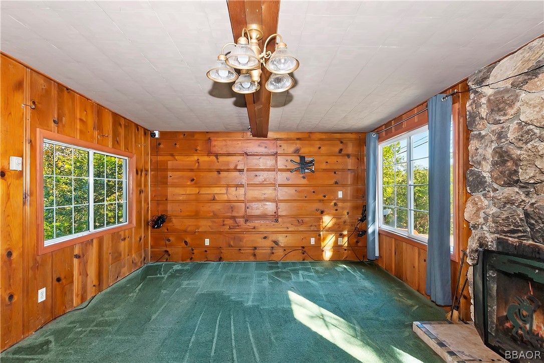24020 Bowl Road Crestline, CA 92325 - Photo 7 of 35 a view of a porch with wooden floor and a fireplace