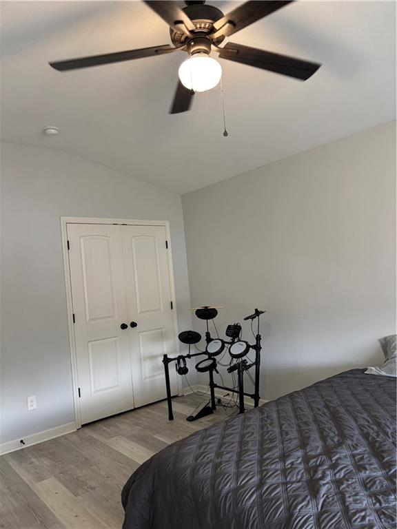 328 Vantage Point Locust Grove, GA 30248 - Photo 17 of 33 a bedroom with a bed and a chandelier