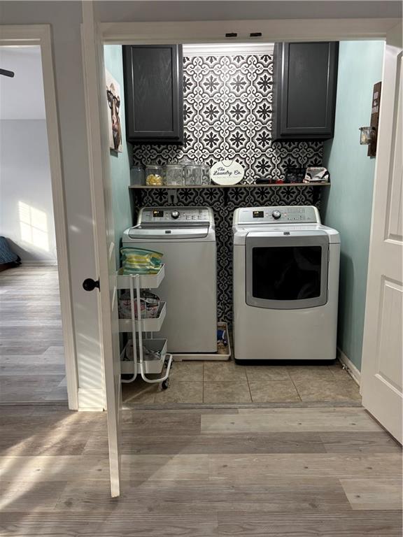 328 Vantage Point Locust Grove, GA 30248 - Photo 20 of 33 a utility room with a stove a washer and dryer
